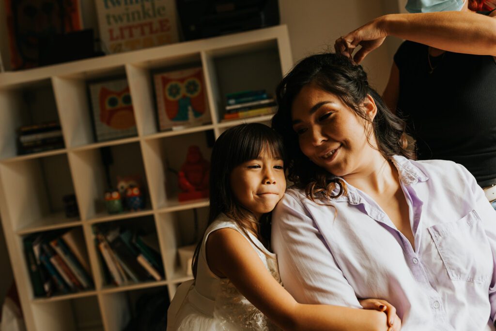 Kimberly's daughter hugging her