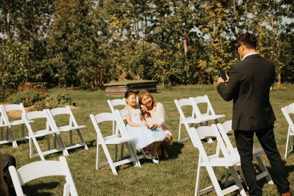 Guests taking photos before the ceremony at Mouton Village