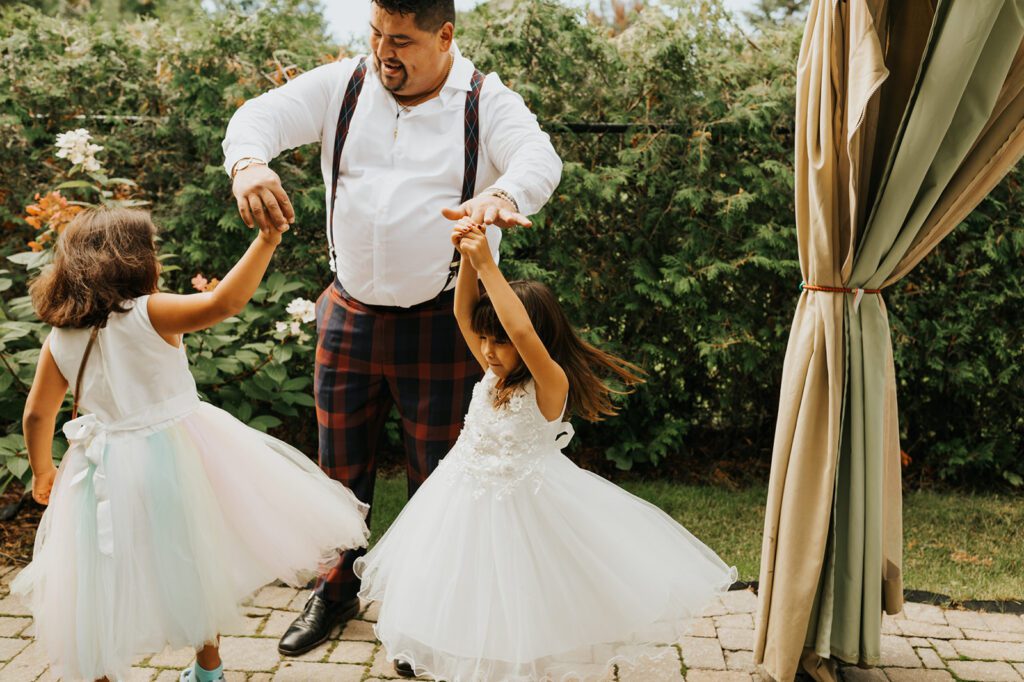 king his daughters twirl before his wedding day at Mouton Village