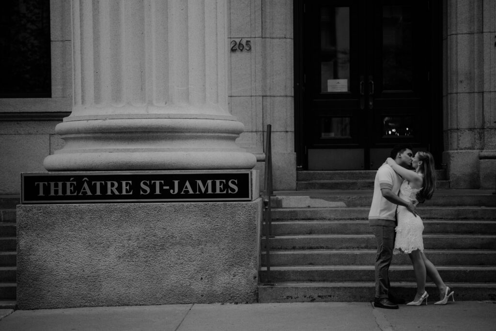 they kiss in front of theatre st james in montreal