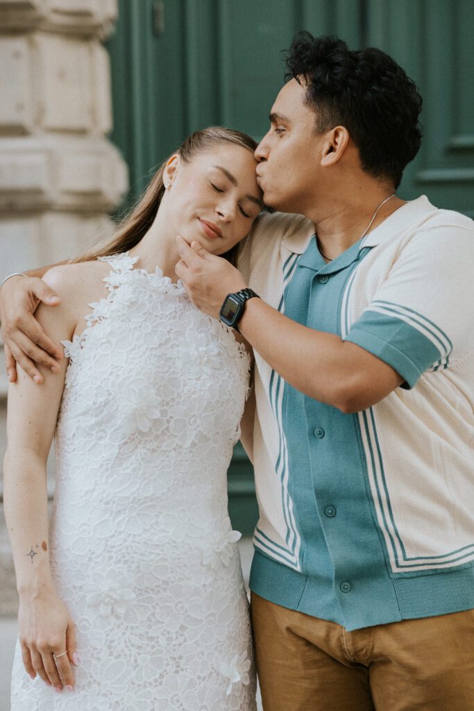 he gives her a kiss on the forehead