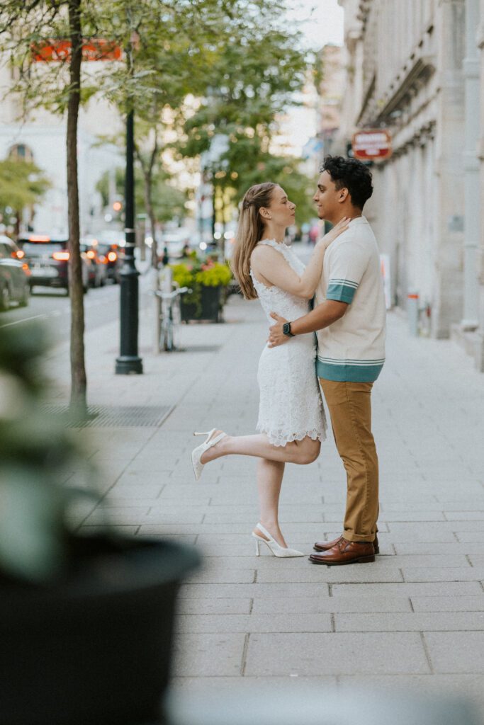 cute engaged couple on a street of montreal