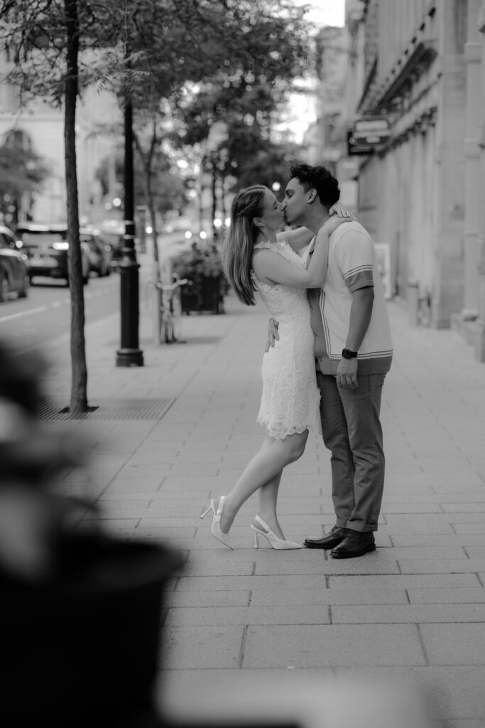 cute engaged couple kissing during their engagement shoot