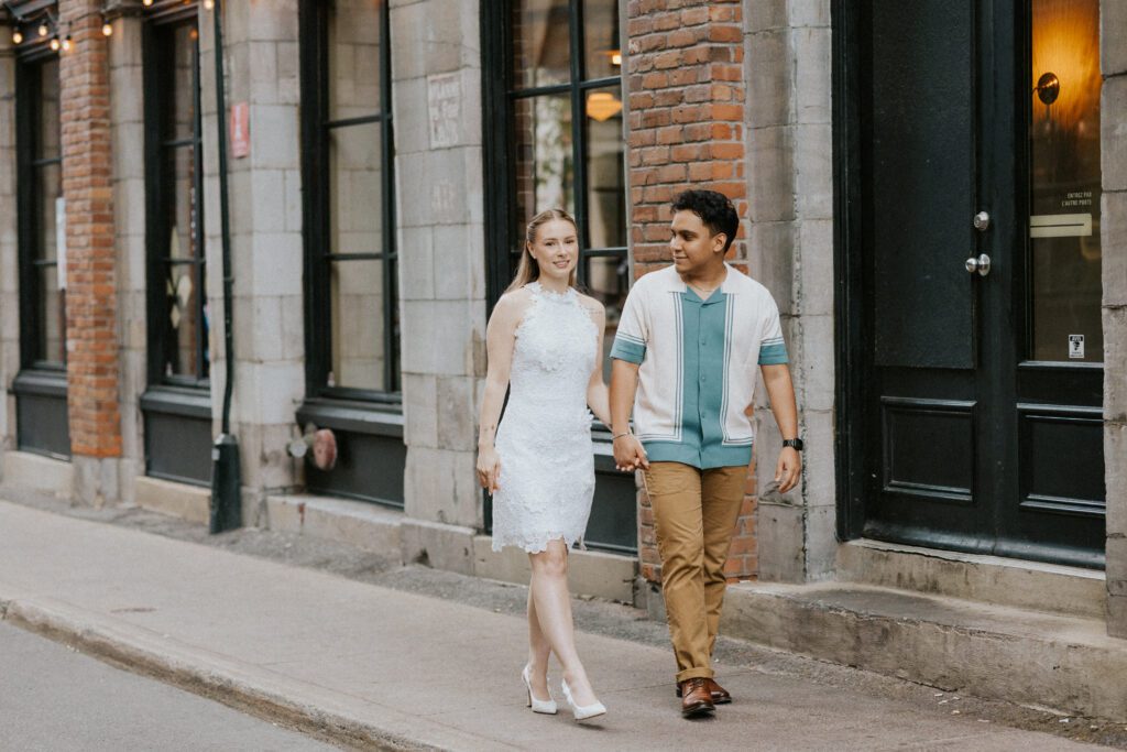 they're walking on the sidewalk of old montreal