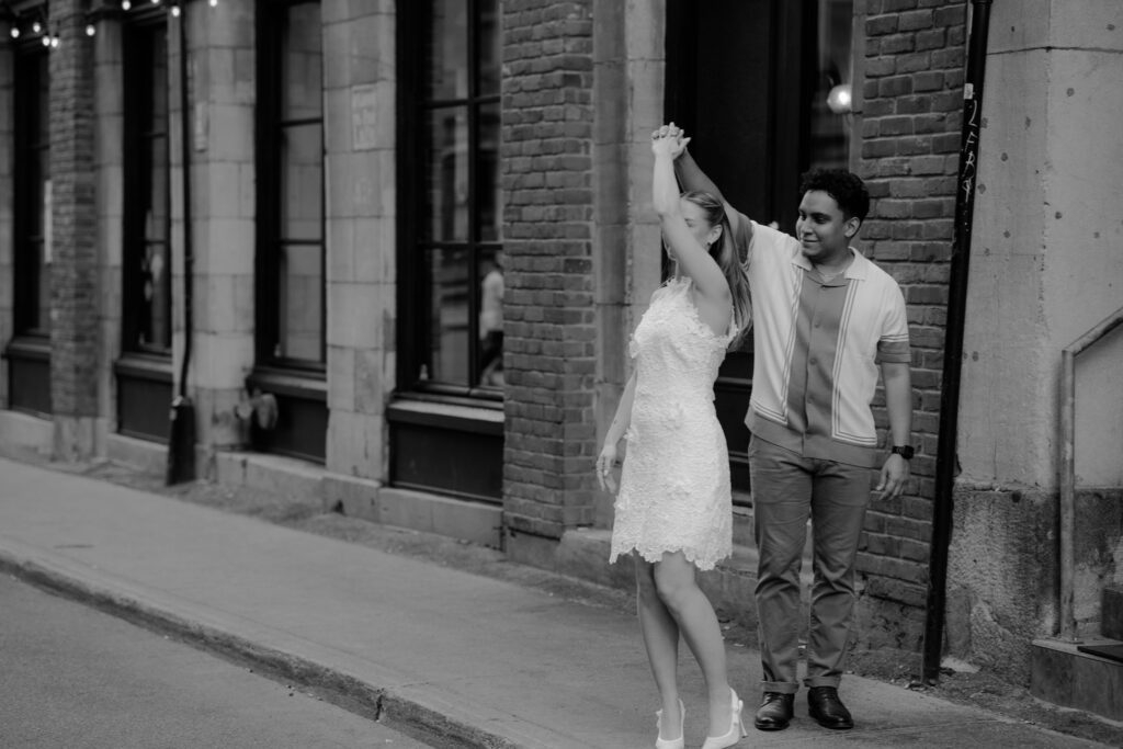he makes her twirl on the sidewalk of old montreal