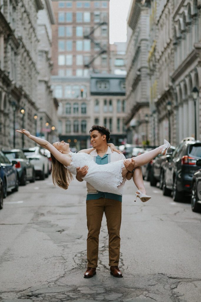 he carries her like a princess in the street of old montreal
