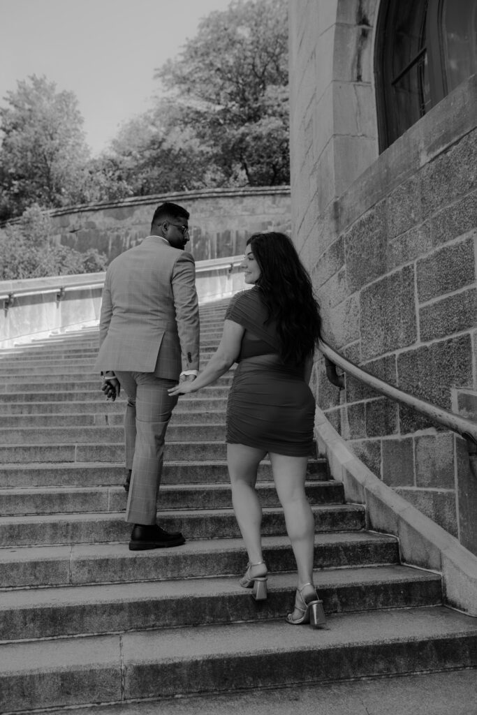 they are climbing up the stairs of the oratory
