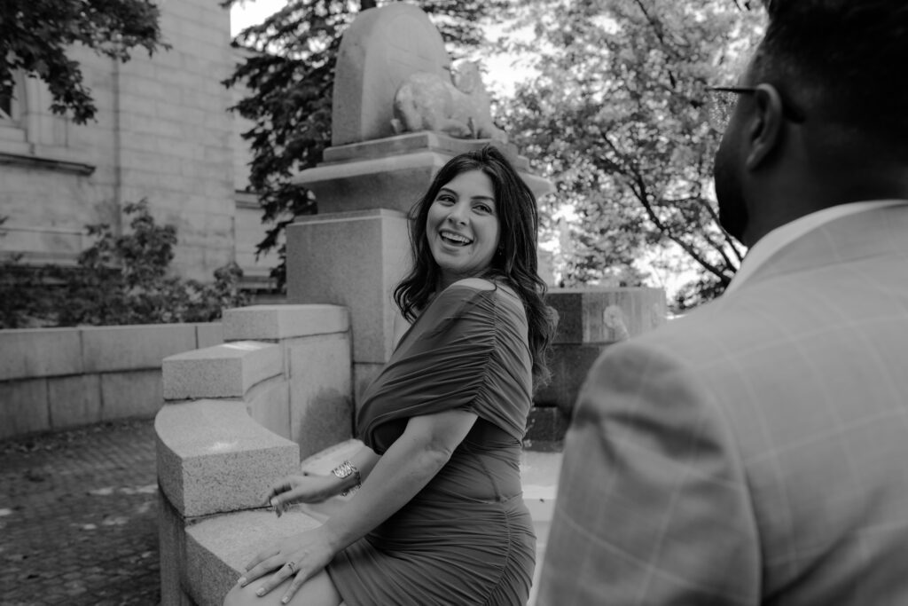 she is laughing during their engagement session at the st-joseph oratory